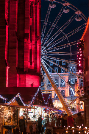 Mulhouse - France - 11 December 2017 - christmas market illuminations with big wheel attraction on place backgroundのeditorial素材
