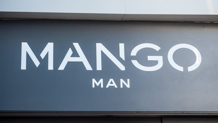 Mulhouse France - 31 December 2017 - retail of Mango sign in mango store for man entryのeditorial素材
