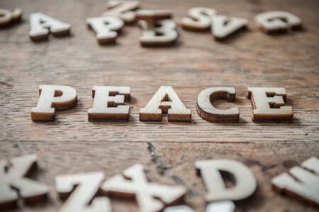 concept wooden letters on wooden table background - Peaceの写真素材