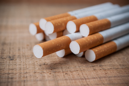 closeup of cigarette on wooden backgroundの写真素材