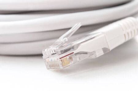 Closeup of ethernet RJ45 white Network Cable on white background