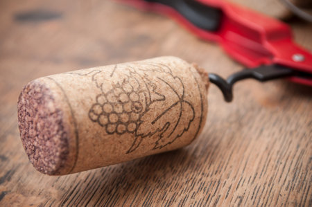 closeup of corks wine and pulls caps on wooden backgroundのeditorial素材