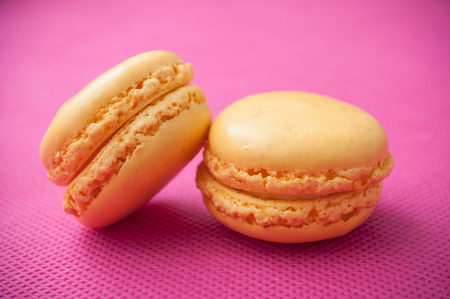 closeup of french macarons pastry on pink backgroundの写真素材