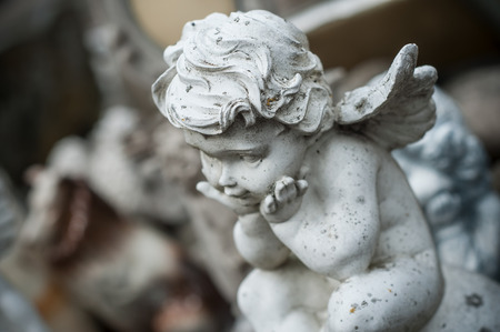 Closeup of stoned angel on tomb in cemeteryの写真素材