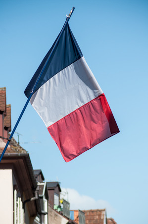 Closeup of french flag on building facade in an asatian villageの写真素材