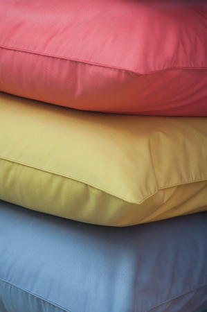 closeup of colorful pillows stack in fashion store showroom の写真素材
