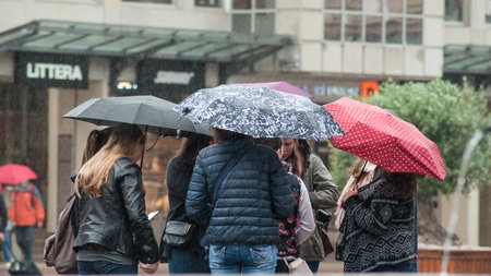 Mulhouse - France - 14 May 2018 - group of people  standing  with umbrella on main placeのeditorial素材