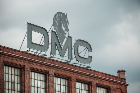Mulhouse - France - 23 May 2018 - DMC sign  in the roof on old factory with brick wall facade