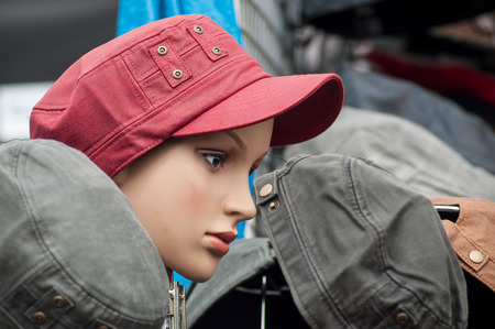 closeup of american army style caps on mannequin in the market