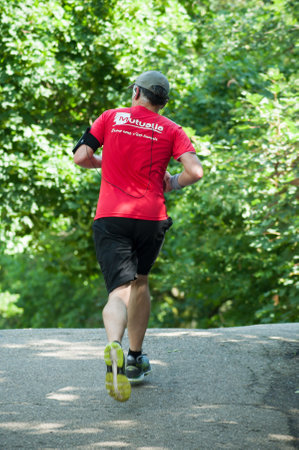 Mulhouse - France - 10 June 2018 - man running in the forest