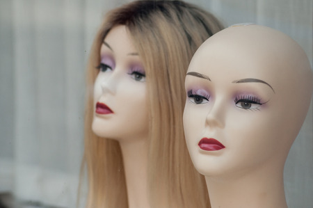 Closeup of woman face of mannequins in fashion store showroomの写真素材