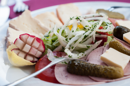 Closeup of traditional alsatian salad with sausage and cheeseの写真素材