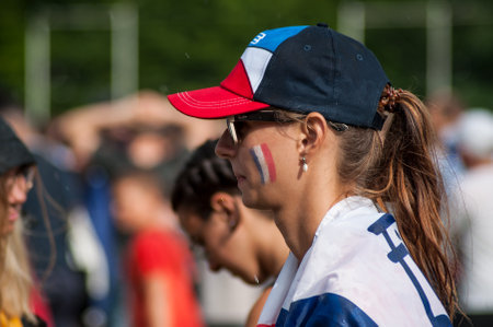 Mulhouse - France - 15 July 2018 - french supporter of football with french flag painting on face during the giant screen projection of the final of the world cup france - croatiaのeditorial素材