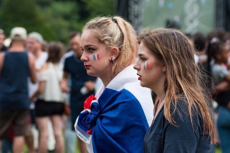 Mulhouse - France - 15 July 2018 - french supporter of football with french flag painting on face during the giant screen projection of the final of the world cup france - croatiaのeditorial素材