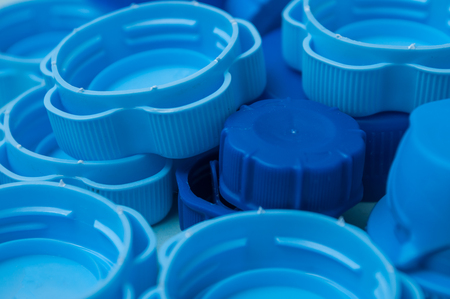 closeup of blue plastic plugs for recycling