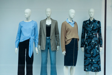 closeup of winter clothes on mannequin in fashion store showroom for women