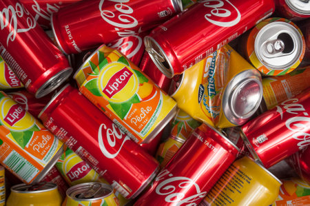 Mulhouse - France - 10 September 2018 - closeup of coca cola and lipton ice tea can for recyclingのeditorial素材