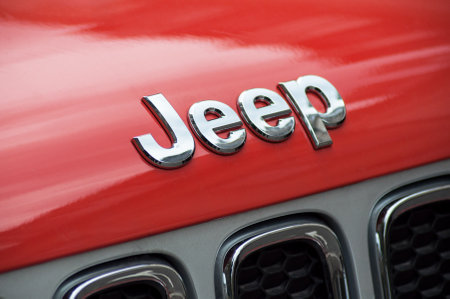 Mulhouse - France - 22 September 2018 - closeup of jeep logo in orange front car parked in the streetのeditorial素材