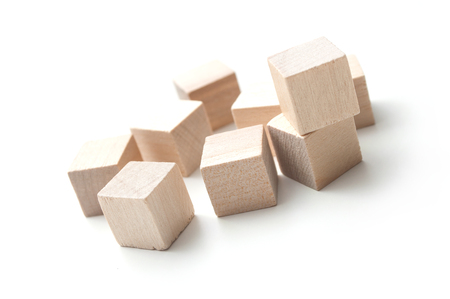 closeup of  piece of wooden brick of construction game on white backgroundの写真素材