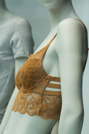 closeup of orange bra on mannequin in fashion store showroom for womenの写真素材