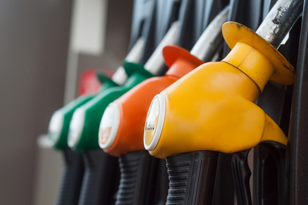 closeup of gas pistols in gas Stationの写真素材
