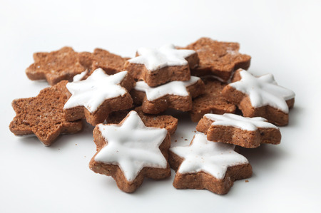 closeup of christmas biscuit in shaped star on white backgroundの写真素材