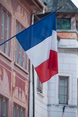 closeup of french flag on building facade in Mulhouse placeの写真素材