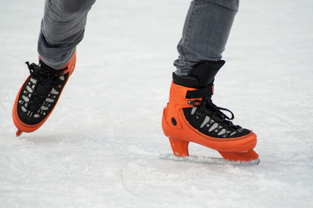 retail of legs of man slipping on an ice christmas rink