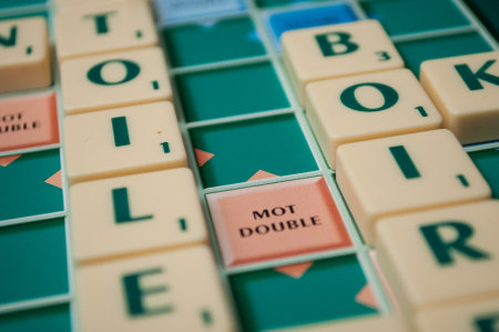 Mulhouse - France - 2 December 2018 - Closeup of plastic letters on Scrabble board gameのeditorial素材