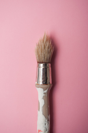 closeup of paint brush on pink backgroundの写真素材