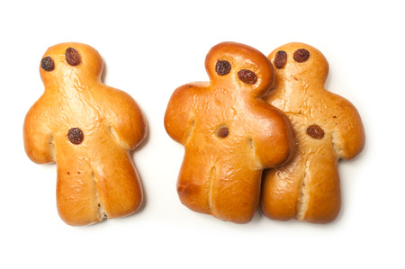closeup of three traditional manalas bun with dried raisin on white backgroundの写真素材