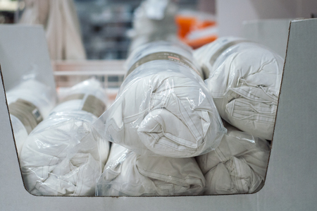 closeup of white set of bed linen rolls in decoration storeの写真素材