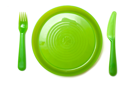 set of green baby plastic kitchen ware on white backgroundの写真素材