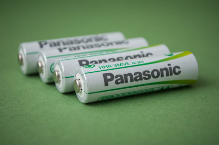 Mulhouse - France - 22 January 2019 - closeup of rechargeable aa alkaline batteries on green...