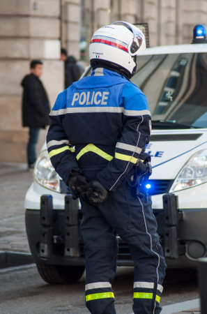 Mulhouse - France - 5 February 2019 - biker of the national police making the traffic, during a demonstration people protesting in the street against taxes and rising fuel pricesのeditorial素材