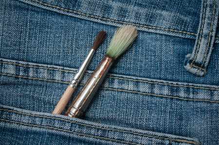 closeup of bruches in blue jeans pocketの写真素材