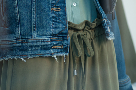 Closeup of  blue jeans vest on manequin  in fashion store showroom for womenの写真素材