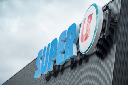 Mulhouse - France - 2 March2019 - Super U sign on store front, Super U is a french chain of supermarket on cloudy sky backgroundのeditorial素材