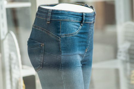 closeup of  elastic blue jeans on mannequin in women fashion store showroomの写真素材