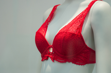 closeup of red bra on mannequin in fashion store showroom for womenの写真素材