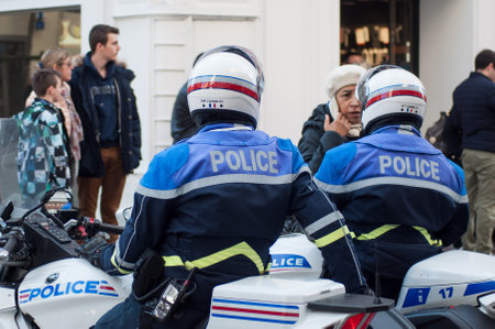 Mulhouse - France - 16 March 2019 - biker of the national police making the traffic, during a demonstration people protesting in the street for save the planetのeditorial素材