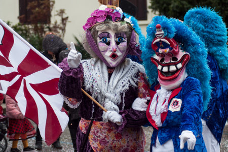 Pfastatt - France - 17 March 2019 - portrait of masked person with blue wig parading in the streetのeditorial素材