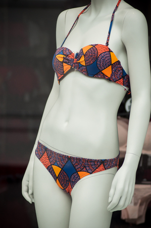 closeup of colorful bikini on mannequin in fashion store showroom for womenの写真素材