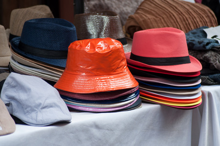 closeup of summer hats collection at the marketの写真素材