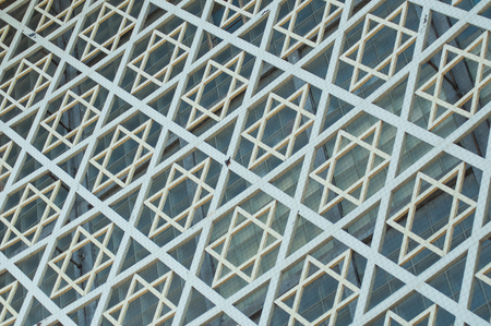 closeup of geometric jewish cross on building facadeの写真素材