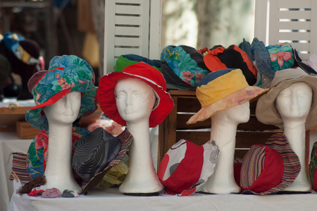 closeup of summer hats collection at the marketの写真素材