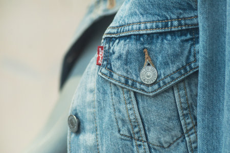 Mulhouse - France - 28 April 2019 - Closeup of Lewis blue jeanss jacket on mannesuin in fashion store showroom for womenのeditorial素材