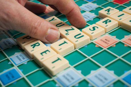 Mulhouse - France - 4 May 2019  - Closeup of plastic letters Z for forming word on Scrabble board gameのeditorial素材