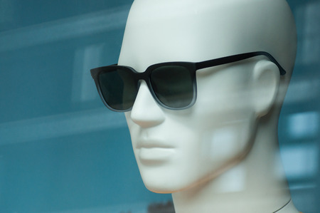 Closeup of sun glasses on mannequin in fashion store swhowroom for menの写真素材