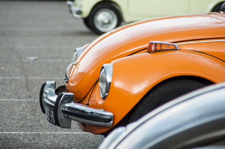 Mulhouse - France - 12 May 2019 -  closeup of orange old Volkswagen beetle parked in the street